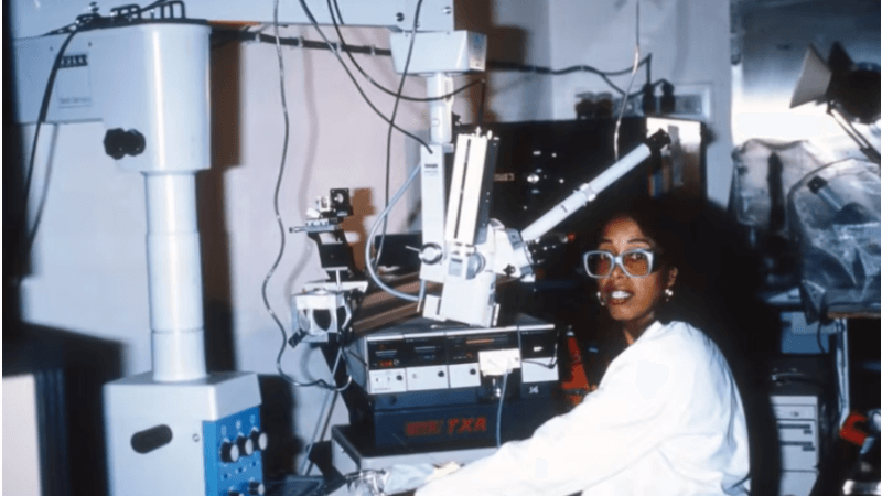 Dr. Patricia Bath sits in an optometry office surrounded by equipment