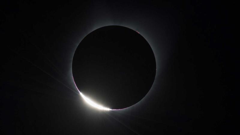 The Diamond Ring effect is seen as the moon makes its final move over the sun during the total solar eclipse on Monday, August 21, 2017 above Madras, Oregon. Photo Credit: (NASA/Aubrey Gemignani)