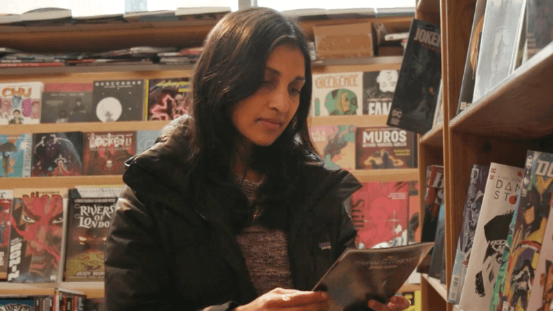 Ritu Raman in a comic book store.