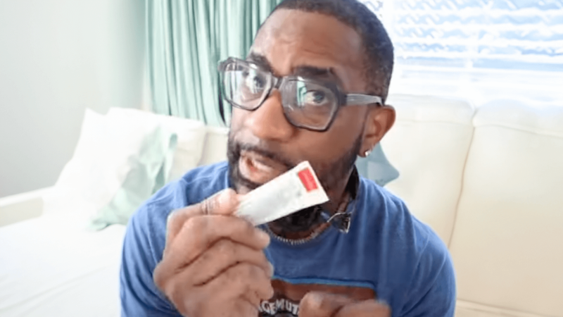 Maynard Okereke holding a tube of toothpaste