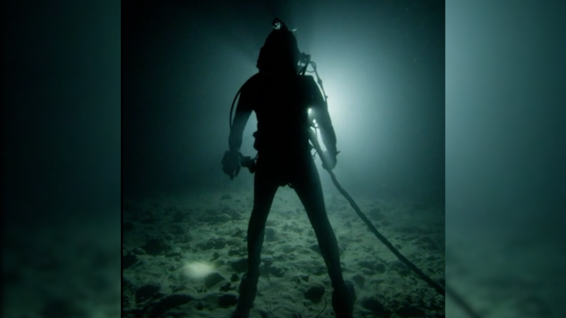 An Aquanaut walking on the ocean floor