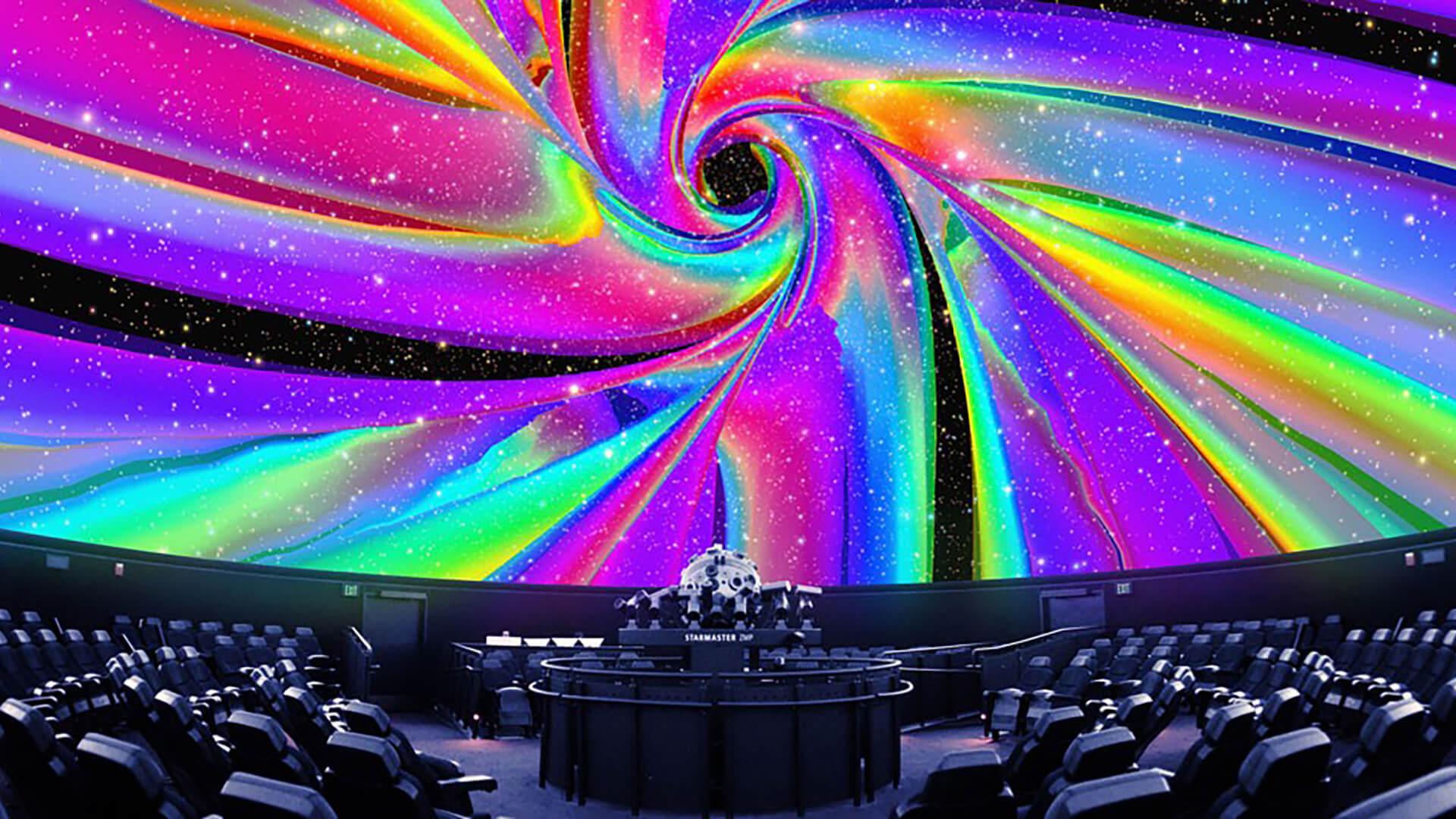 A swirl of rainbow colors projected onto the Planetarium dome.