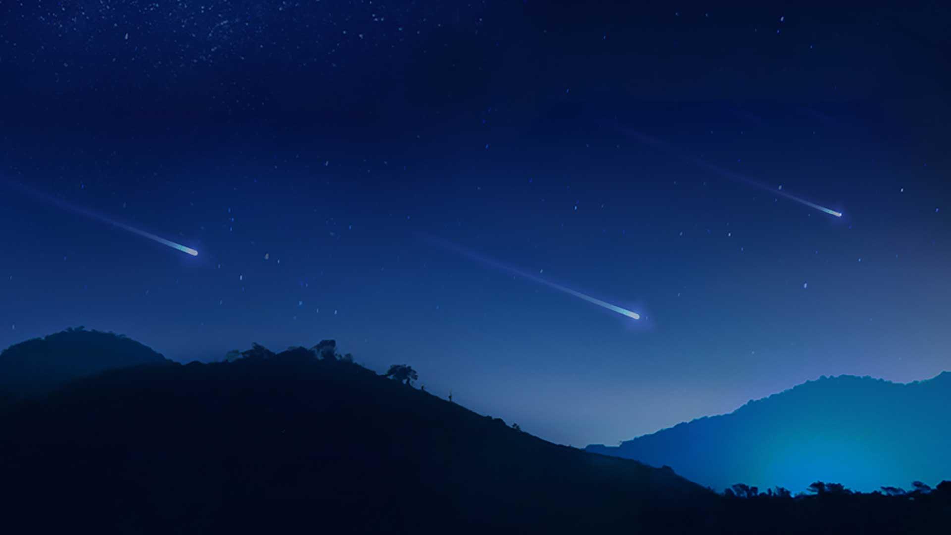 An illustration of shooting stars over mountains.