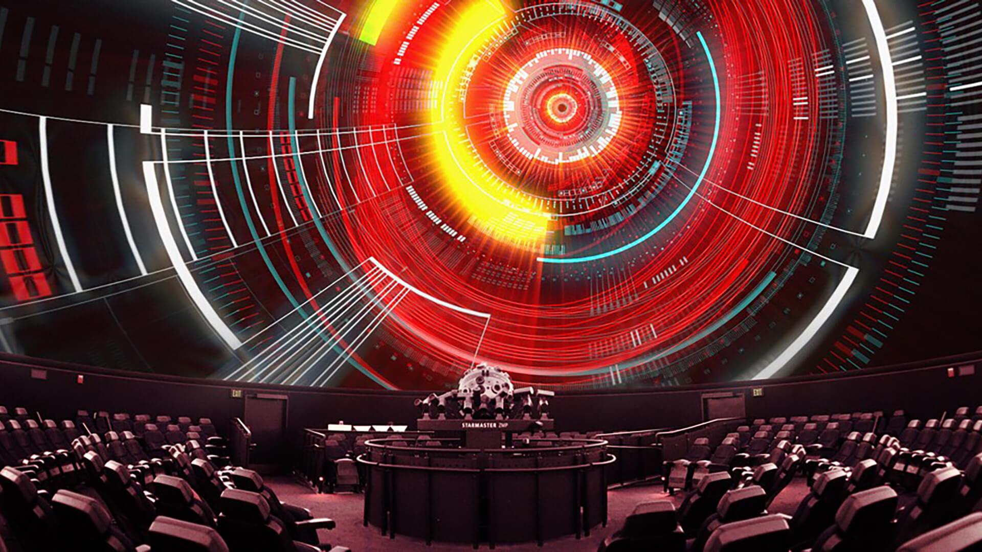 Circular patterns in red, yellow, white and black, projected onto the Planetarium dome.