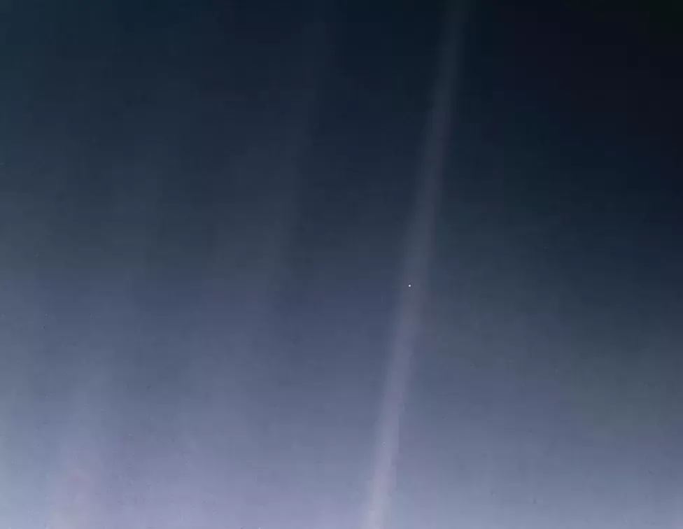 The Pale Blue Dot - a photo taken by Voyager 1 when it was about four billion miles away from Earth.