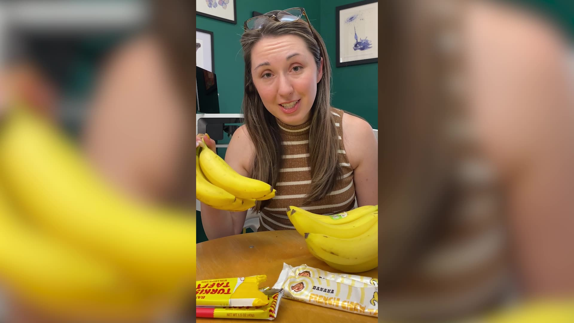 Alex Dainis holding up a bunch of bananas