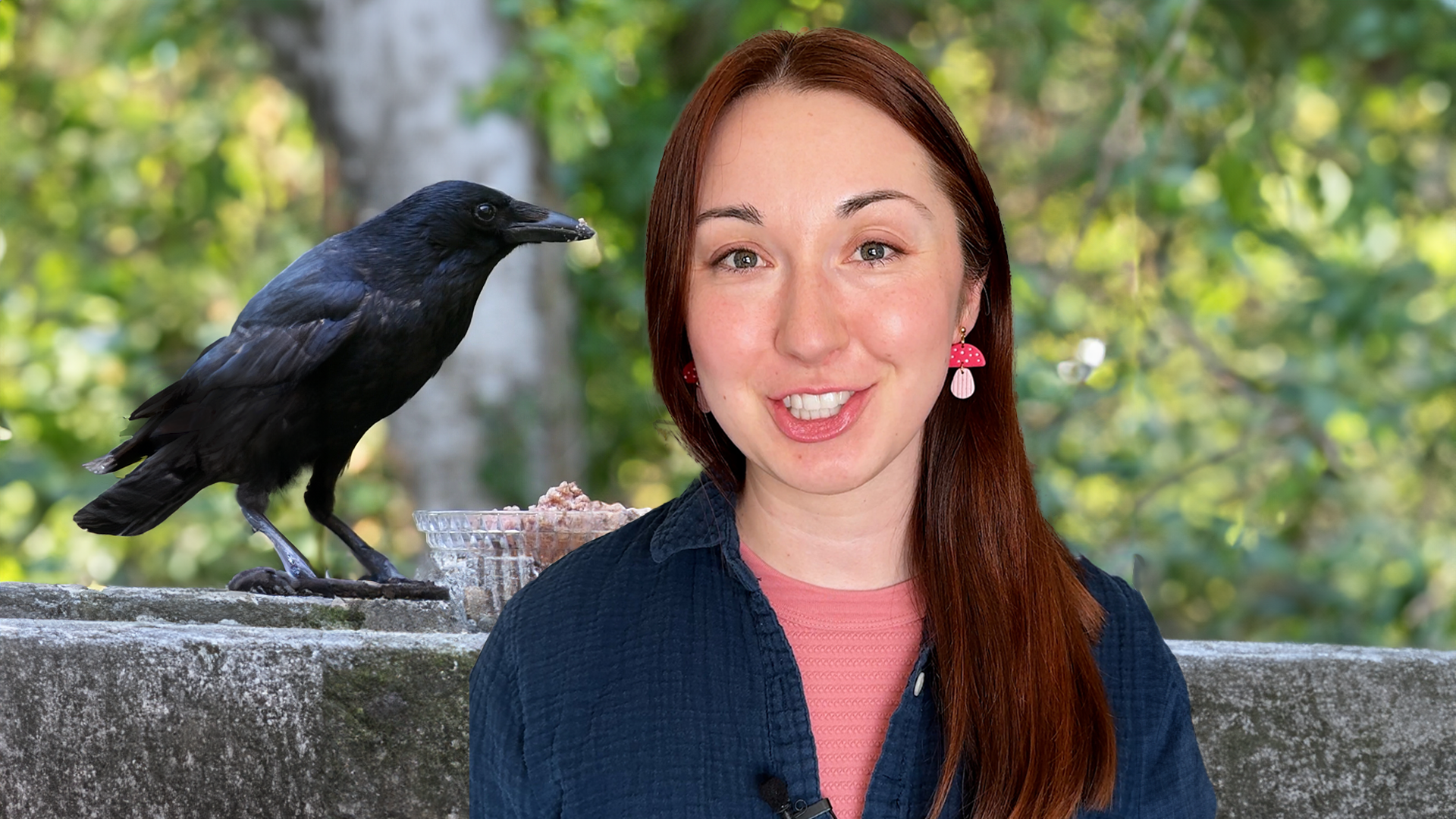 Alex Dainis smiling with a crow in the background.