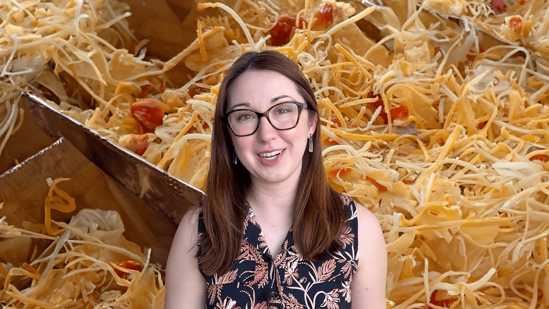 Alex Dainis in front of a pile of nachos