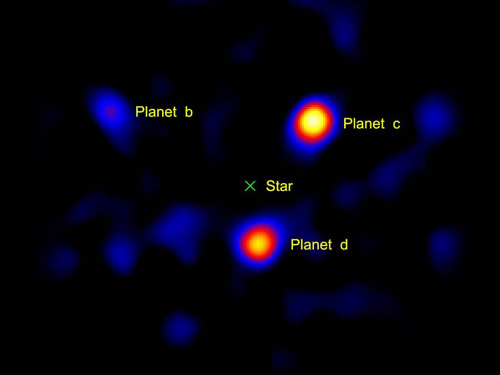 This image shows what directly imaged exoplanets look like. Note that the light from the star has had to be blocked out to make seeing the planets possible. Credit: NASA/JPL-Caltech/Palomar Observatory