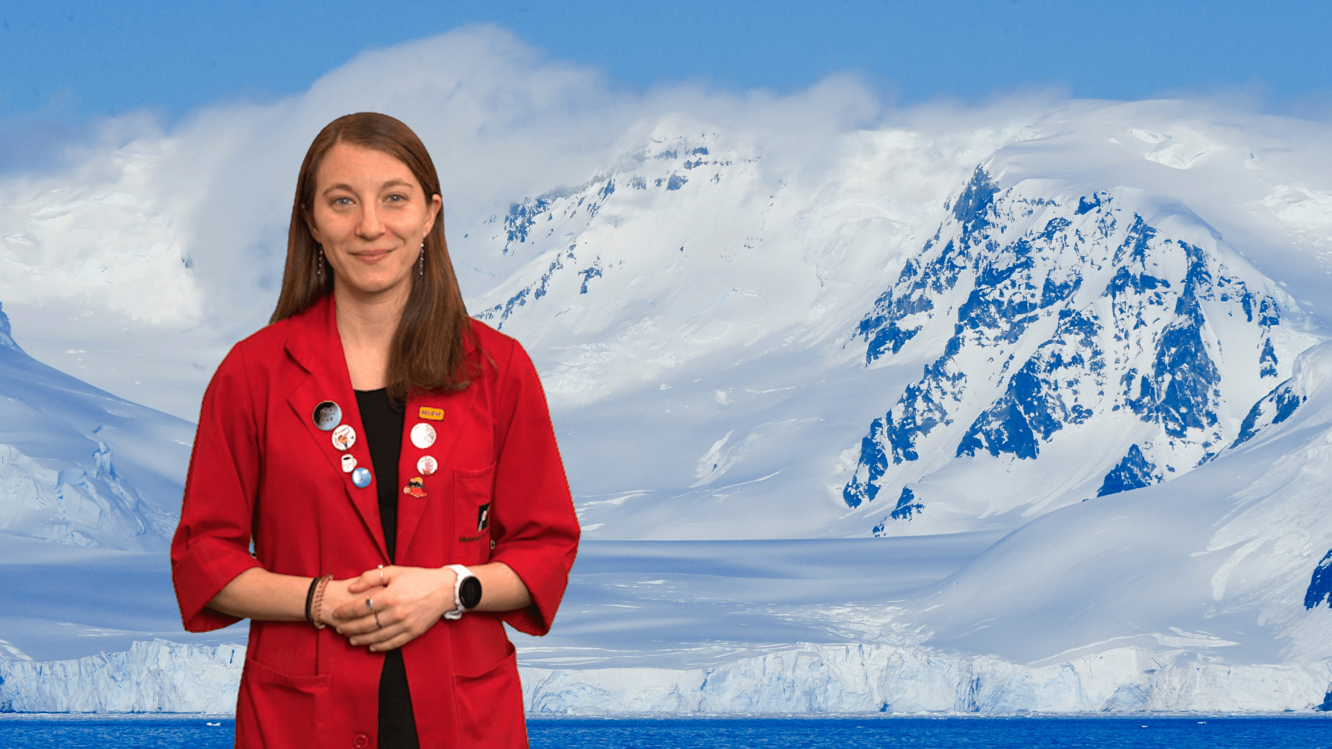 Museum Educator Sloane in front of an Antarctic landscape