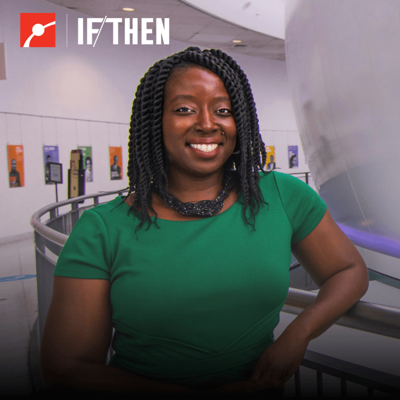 Afua Bruce smiles at the camera in a green top