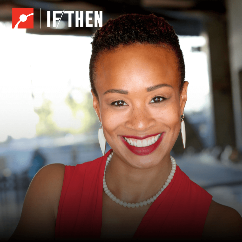 Jasmine Sadler smiles at the viewer in a red top